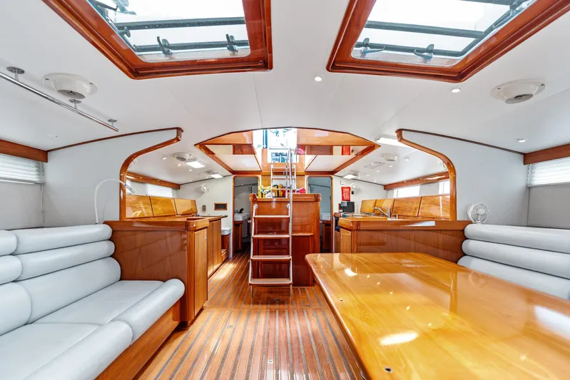 Godspeed Yacht Photos Pics Luxurious interior of 1998 Custom Kelly Archer yacht with wooden finishes and skylights.