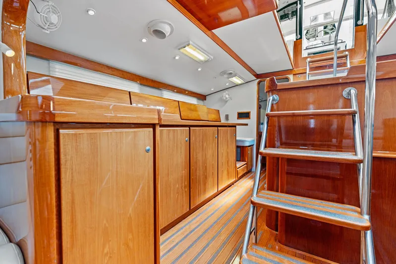 Godspeed Yacht Photos Pics Luxurious wooden interior of 1998 Custom Kelly Archer yacht with polished cabinets and stairs.