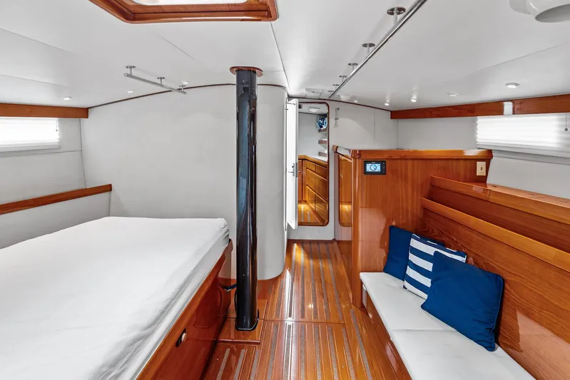 Godspeed Yacht Photos Pics Luxurious 1998 Custom Kelly Archer yacht interior with wooden finishes and cozy seating area.