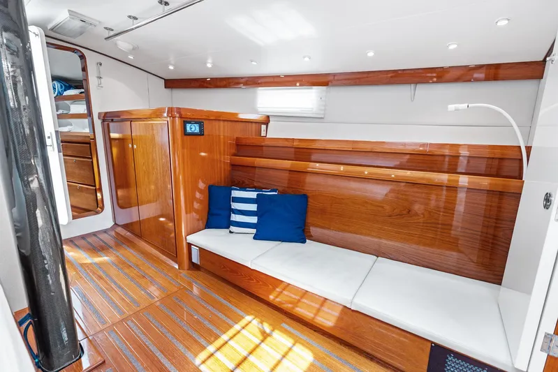 Godspeed Yacht Photos Pics Luxurious wooden interior of 1998 Custom Kelly Archer yacht with seating and cushions.