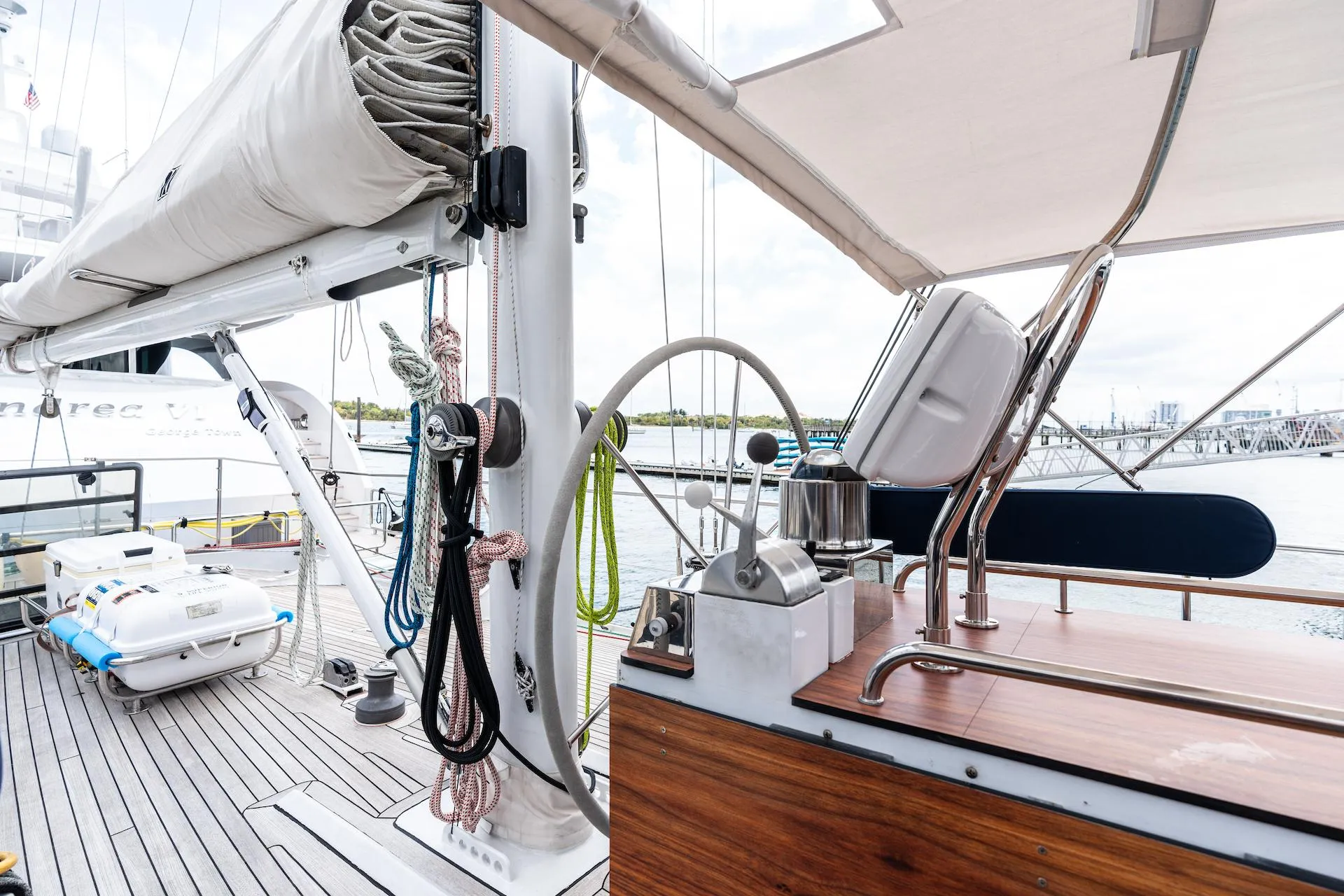 Sailing yacht deck with steering wheel, ropes, and equipment, Custom Kelly Archer 1998 model.