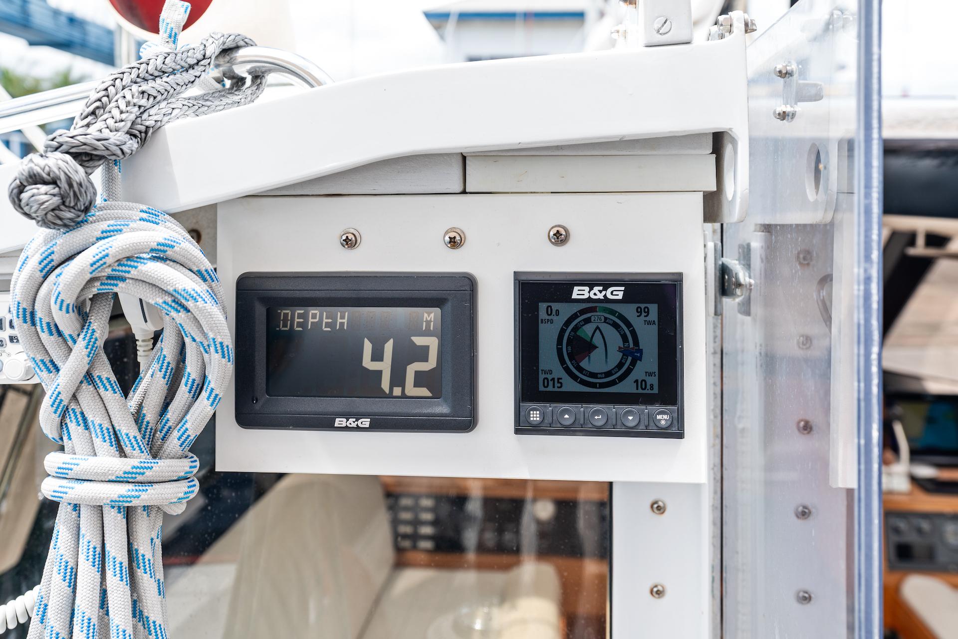 Digital navigation instruments on a 1998 Custom Kelly Archer boat, displaying depth and compass readings.