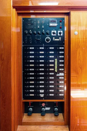 Godspeed Yacht Photos Pics Electrical control panel on a 1998 Custom Kelly Archer boat, featuring switches and gauges.