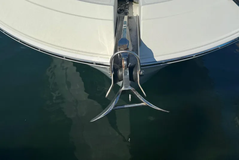  Yacht Photos Pics Bow of 2011 Hydra-Sports 3000 VX boat with anchor in water.