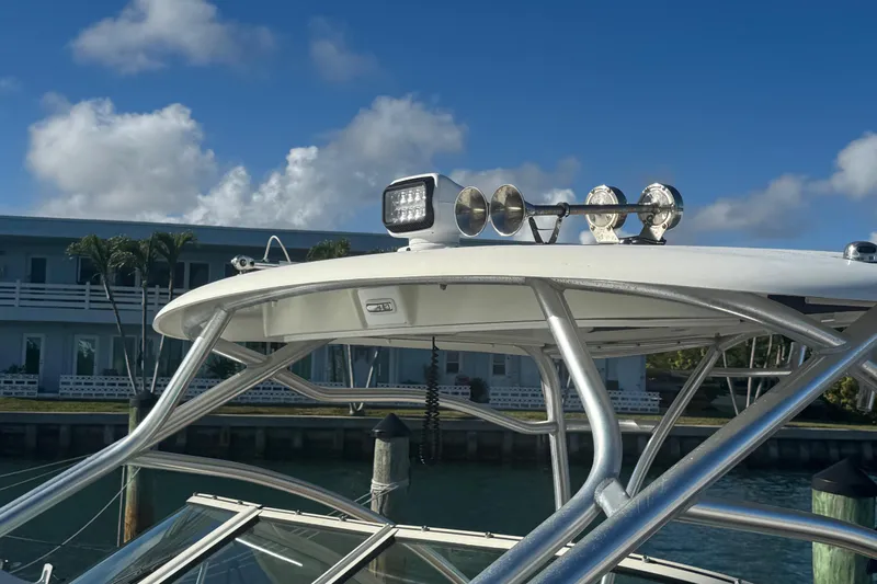  Yacht Photos Pics 2011 Hydra-Sports 3000 VX boat with radar and lights, docked under a clear blue sky.
