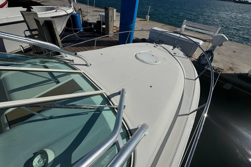  Yacht Photos Pics 2011 Hydra-Sports 3000 VX boat docked at marina, showcasing sleek deck design.