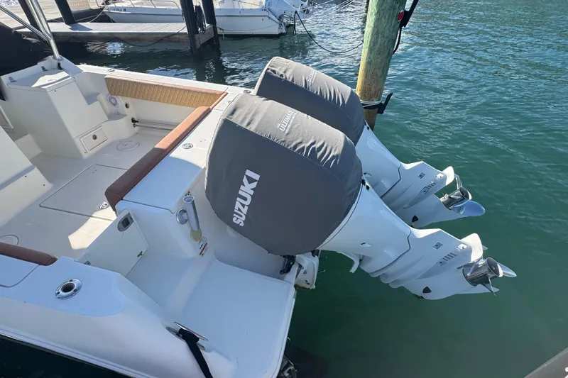  Yacht Photos Pics 2011 Hydra-Sports 3000 VX boat with dual Suzuki outboard motors at dock.