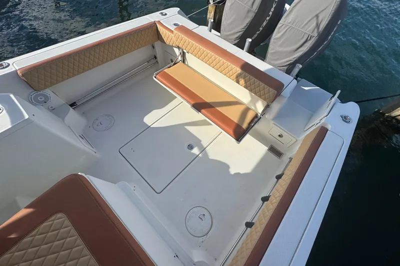  Yacht Photos Pics 2011 Hydra-Sports 3000 VX boat interior with cushioned seating and storage compartments.