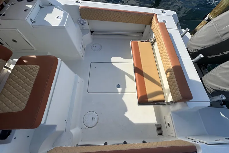  Yacht Photos Pics 2011 Hydra-Sports 3000 VX boat interior with cushioned seating and storage compartments.