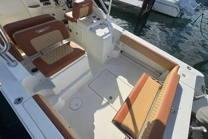  Yacht Photos Pics 2011 Hydra-Sports 3000 VX boat interior with cushioned seating and storage compartments.