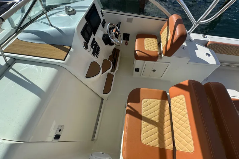  Yacht Photos Pics 2011 Hydra-Sports 3000 VX boat interior with tan leather seating and modern dashboard.