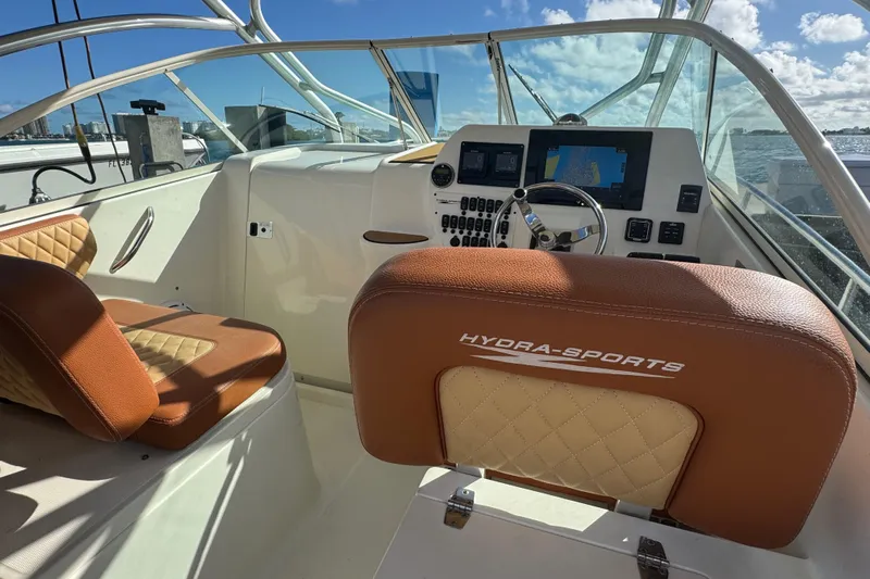  Yacht Photos Pics 2011 Hydra-Sports 3000 VX boat interior with leather seating and navigation controls.