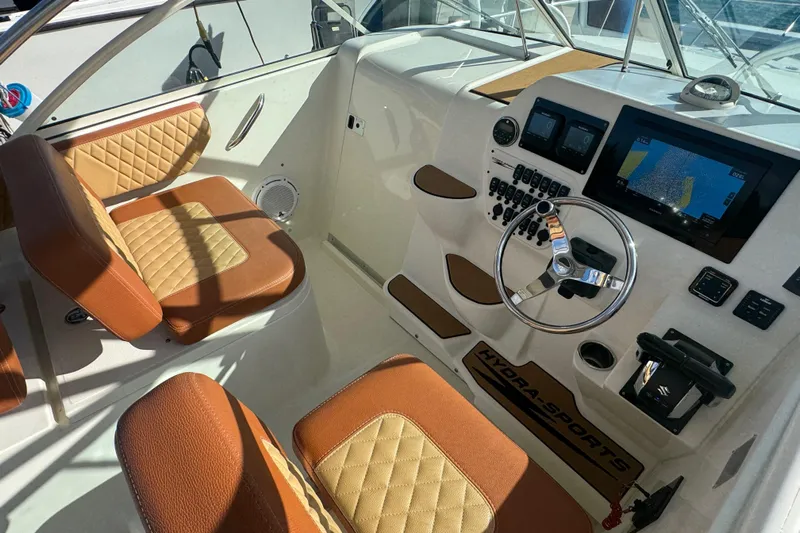  Yacht Photos Pics 2011 Hydra-Sports 3000 VX boat interior with tan leather seats and modern dashboard.