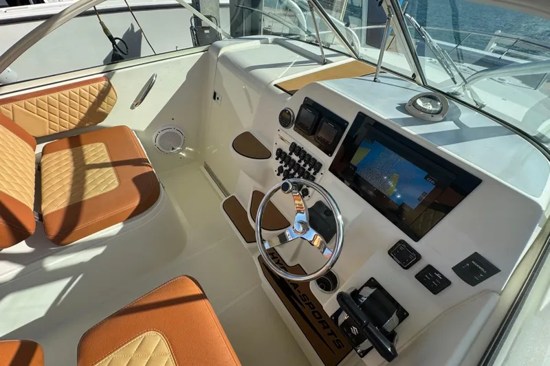  Yacht Photos Pics 2011 Hydra-Sports 3000 VX boat cockpit with modern controls and tan seating.