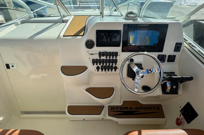  Yacht Photos Pics 2011 Hydra-Sports 3000 VX boat dashboard with steering wheel and navigation controls.