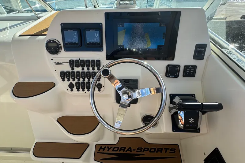  Yacht Photos Pics 2011 Hydra-Sports 3000 VX boat dashboard with steering wheel and navigation controls.