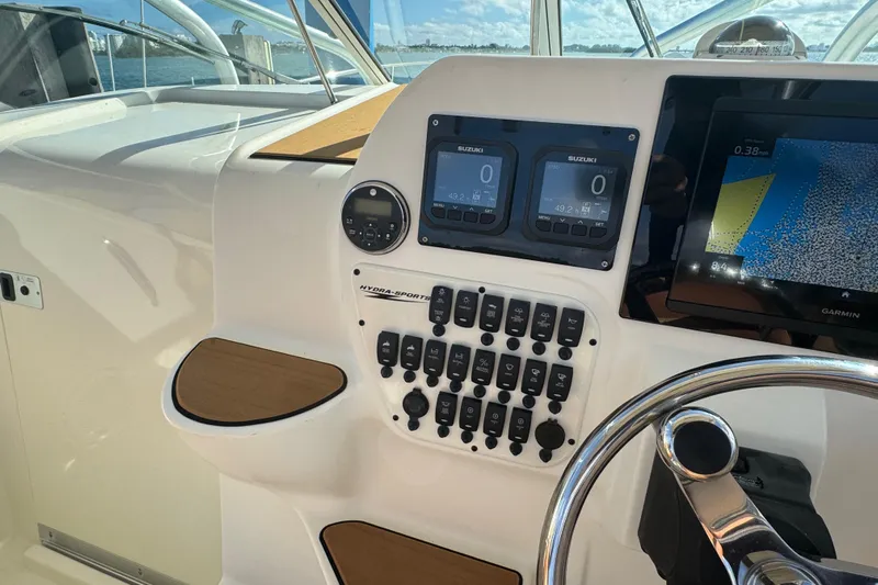  Yacht Photos Pics Control panel of a 2011 Hydra-Sports 3000 VX boat with navigation and engine displays.