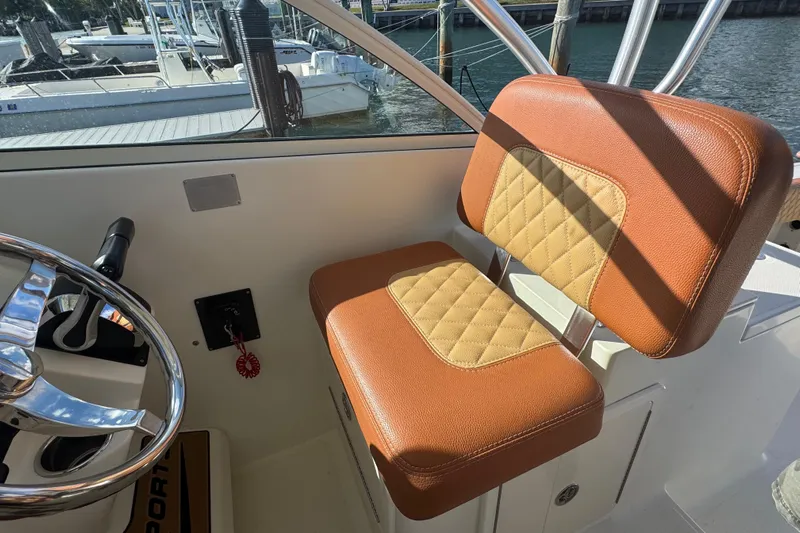  Yacht Photos Pics 2011 Hydra-Sports 3000 VX boat interior with tan and brown seating, steering wheel visible.
