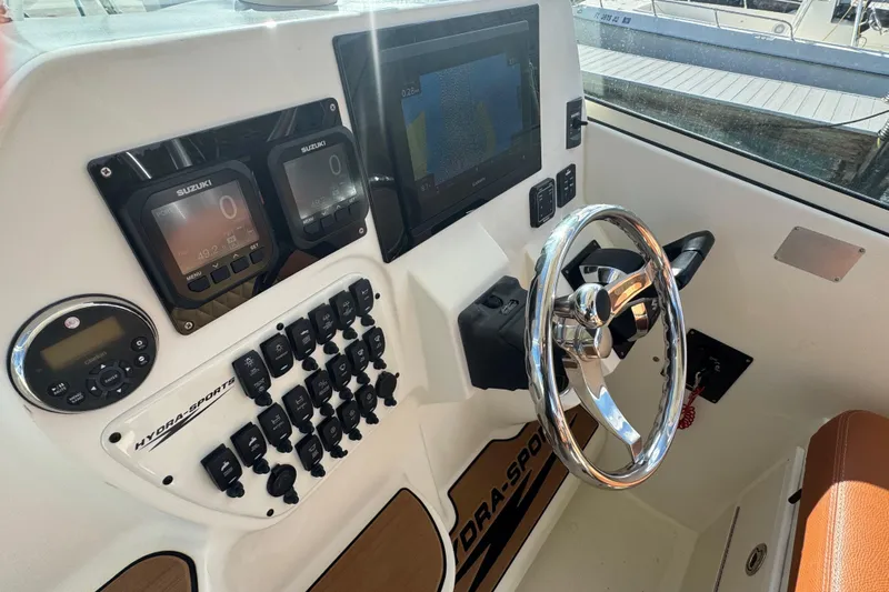  Yacht Photos Pics 2011 Hydra-Sports 3000 VX boat dashboard with steering wheel and electronic controls.