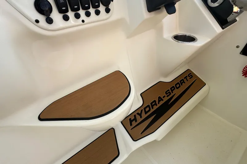  Yacht Photos Pics 2011 Hydra-Sports 3000 VX boat interior with control panel and branded step mat.