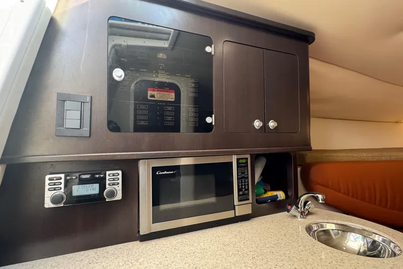  Yacht Photos Pics 2011 Hydra-Sports 3000 VX cabin with microwave, sink, and control panel.