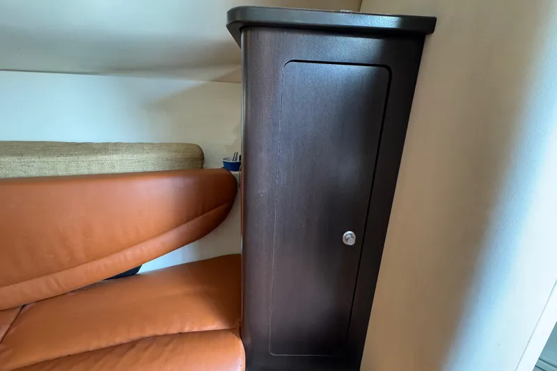  Yacht Photos Pics 2011 Hydra-Sports 3000 VX interior with brown leather seating and dark wood cabinet.