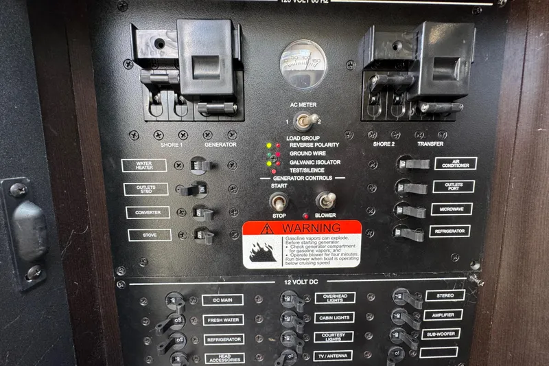  Yacht Photos Pics Electrical control panel of 2011 Hydra-Sports 3000 VX boat with various switches and warning label.