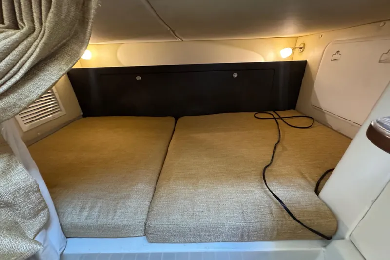  Yacht Photos Pics 2011 Hydra-Sports 3000 VX cabin interior with cozy sleeping area and ambient lighting.