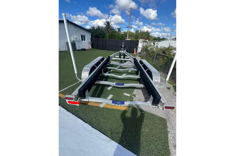  Yacht Photos Pics Trailer for 2011 Hydra-Sports 3000 VX on grass, under blue sky.