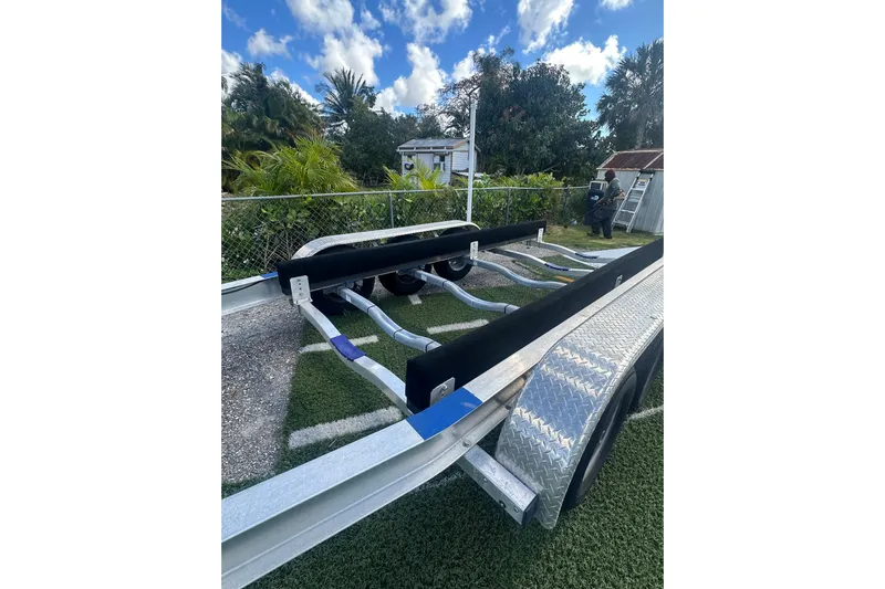  Yacht Photos Pics Trailer for 2011 Hydra-Sports 3000 VX boat, parked on grass with trees in background.