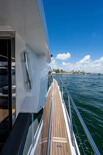  Yacht Photos Pics 2022 Azimut S6 yacht deck with ocean view and clear blue sky.