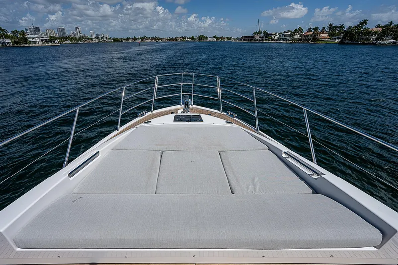  Yacht Photos Pics Bow view of 2022 Azimut S6 yacht with sunbed, cruising on a sunny day.