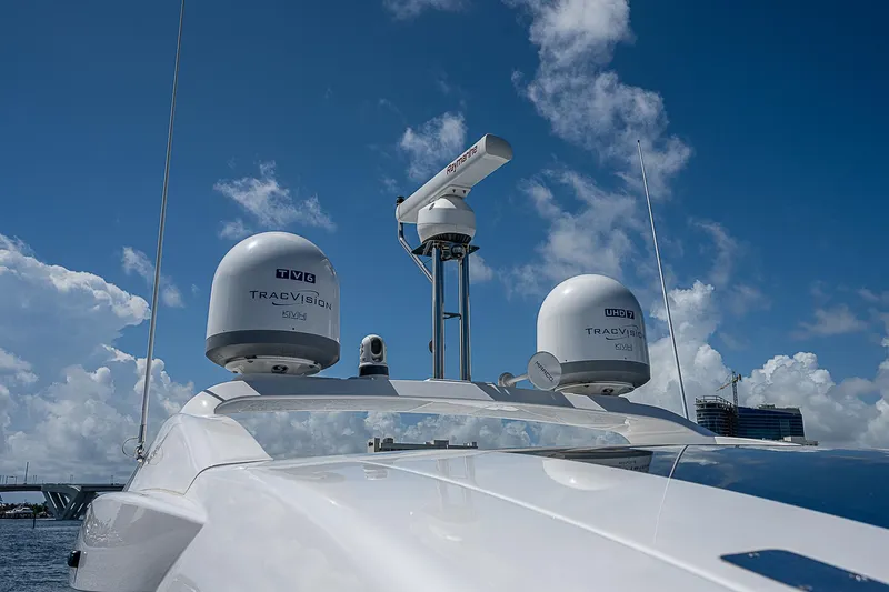  Yacht Photos Pics 2022 Azimut S6 yacht with radar and satellite domes against a blue sky.