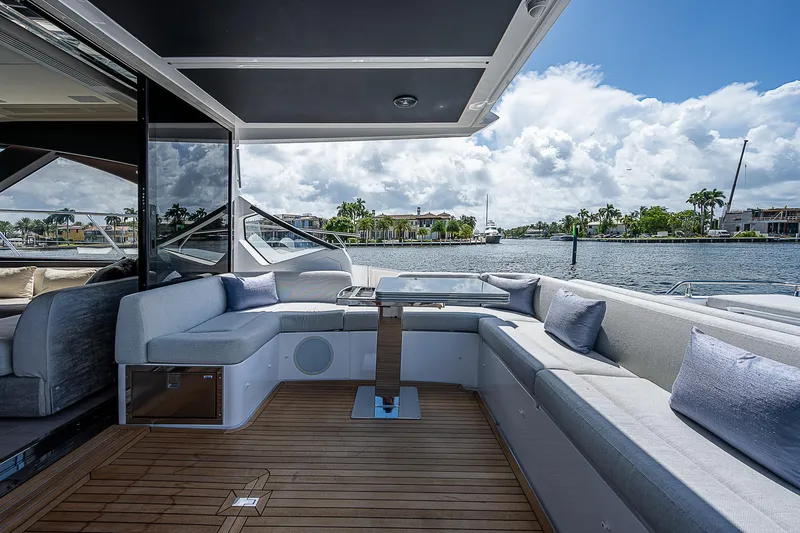  Yacht Photos Pics Luxurious 2022 Azimut S6 yacht deck with elegant seating and scenic waterfront view.