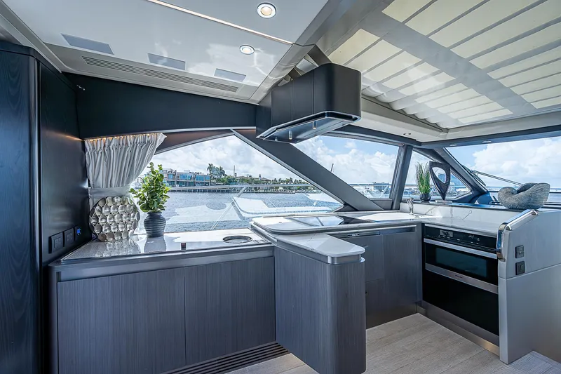  Yacht Photos Pics Luxurious interior of 2022 Azimut S6 yacht with modern kitchen and scenic window views.