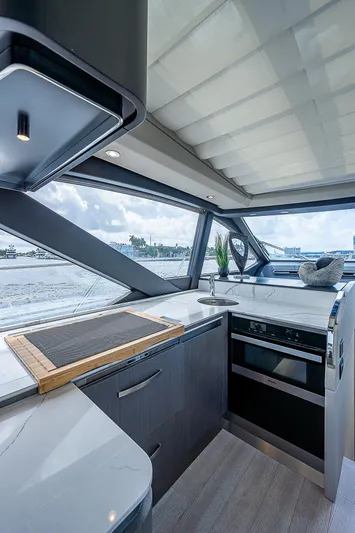  Yacht Photos Pics Modern kitchen interior of 2022 Azimut S6 yacht with sleek design and ocean view.