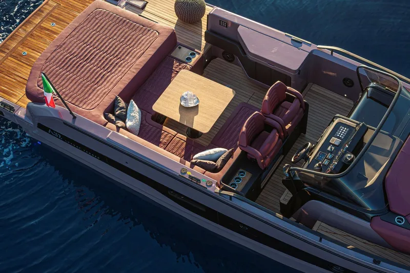  Yacht Photos Pics 2025 Cranchi A32 Luxury Tender with elegant seating and modern dashboard on calm water.