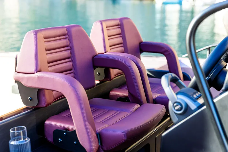 Yacht Photos Pics Luxury seating on 2025 Cranchi A32 Luxury Tender with purple upholstery.