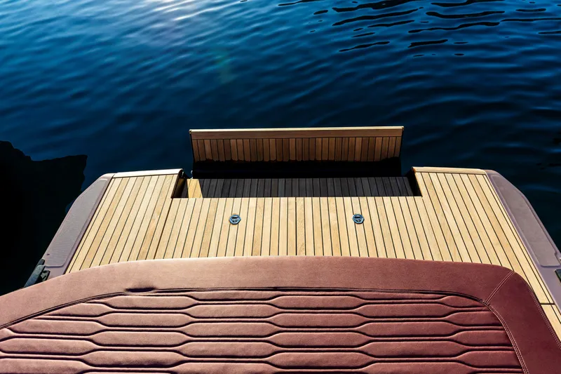  Yacht Photos Pics 2025 Cranchi A32 Luxury Tender with elegant teak deck and water view.