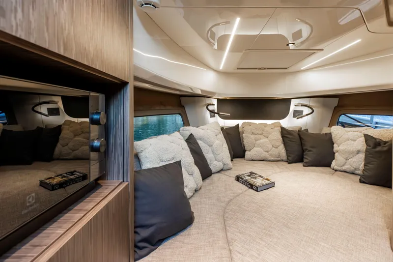  Yacht Photos Pics Luxurious interior of 2025 Cranchi A32 Luxury Tender with plush seating and modern design.