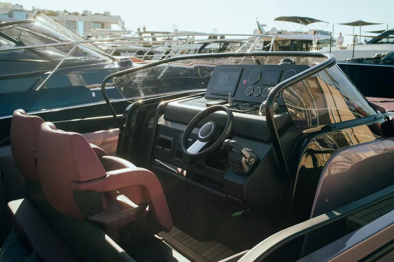  Yacht Photos Pics 2025 Cranchi A32 Luxury Tender cockpit with modern steering and controls.