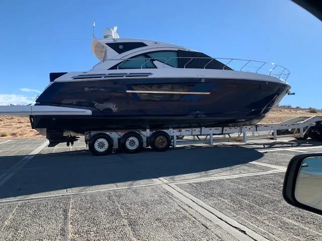  Yacht Photos Pics 2018 Cruisers Yachts 54 Cantius on trailer under clear blue sky.