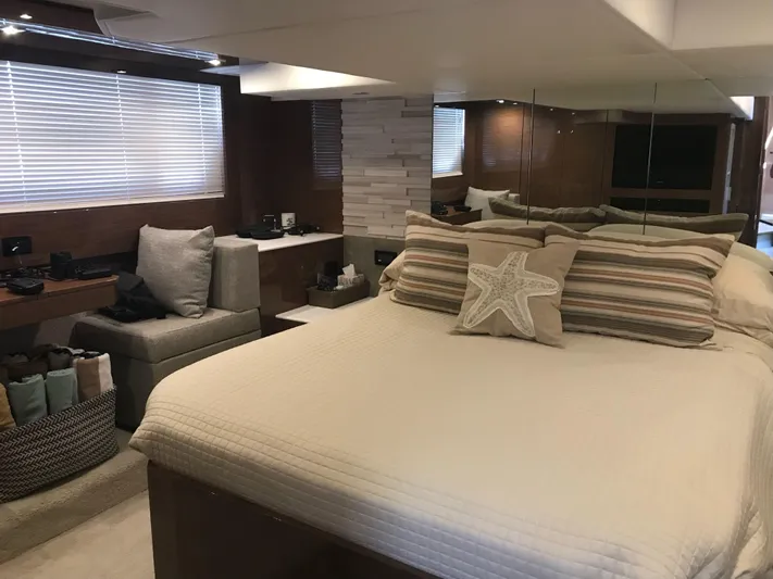  Yacht Photos Pics Luxurious bedroom interior of 2018 Cruisers Yachts 54 Cantius with modern decor and cozy bedding.