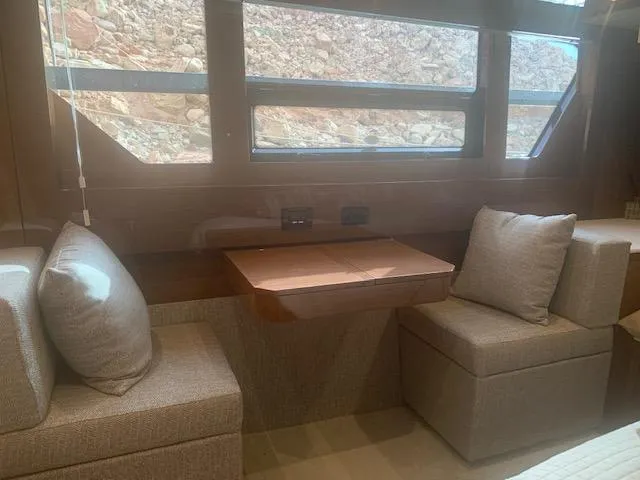  Yacht Photos Pics Interior of 2018 Cruisers Yachts 54 Cantius with seating and table by windows.