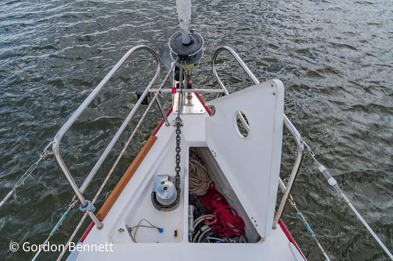 Queens Share Yacht Photos Pics Bow of 2008 Beneteau Oceanis 43 sailboat with open anchor locker and ropes.