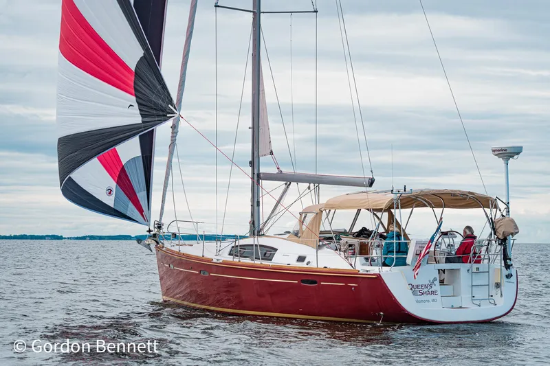 Queens Share Yacht Photos Pics 2008 Beneteau Oceanis 43 sailboat with colorful sails on open water.