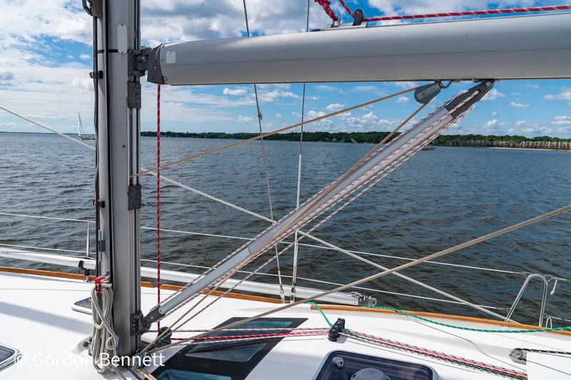 Queens Share Yacht Photos Pics Sailing on a 2008 Beneteau Oceanis 43 yacht, overlooking calm waters and blue skies.