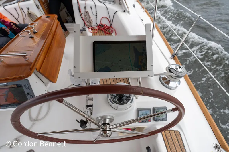Queens Share Yacht Photos Pics Steering wheel and navigation equipment on a 2008 Beneteau Oceanis 43 sailboat.