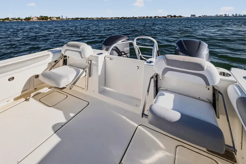  Yacht Photos Pics 2017 World Cat 295 DC boat interior with seating, on a sunny day at sea.