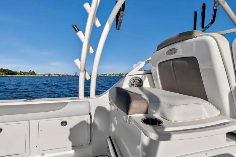  Yacht Photos Pics 2017 World Cat 295 DC boat interior with seating, cup holder, and ocean view.